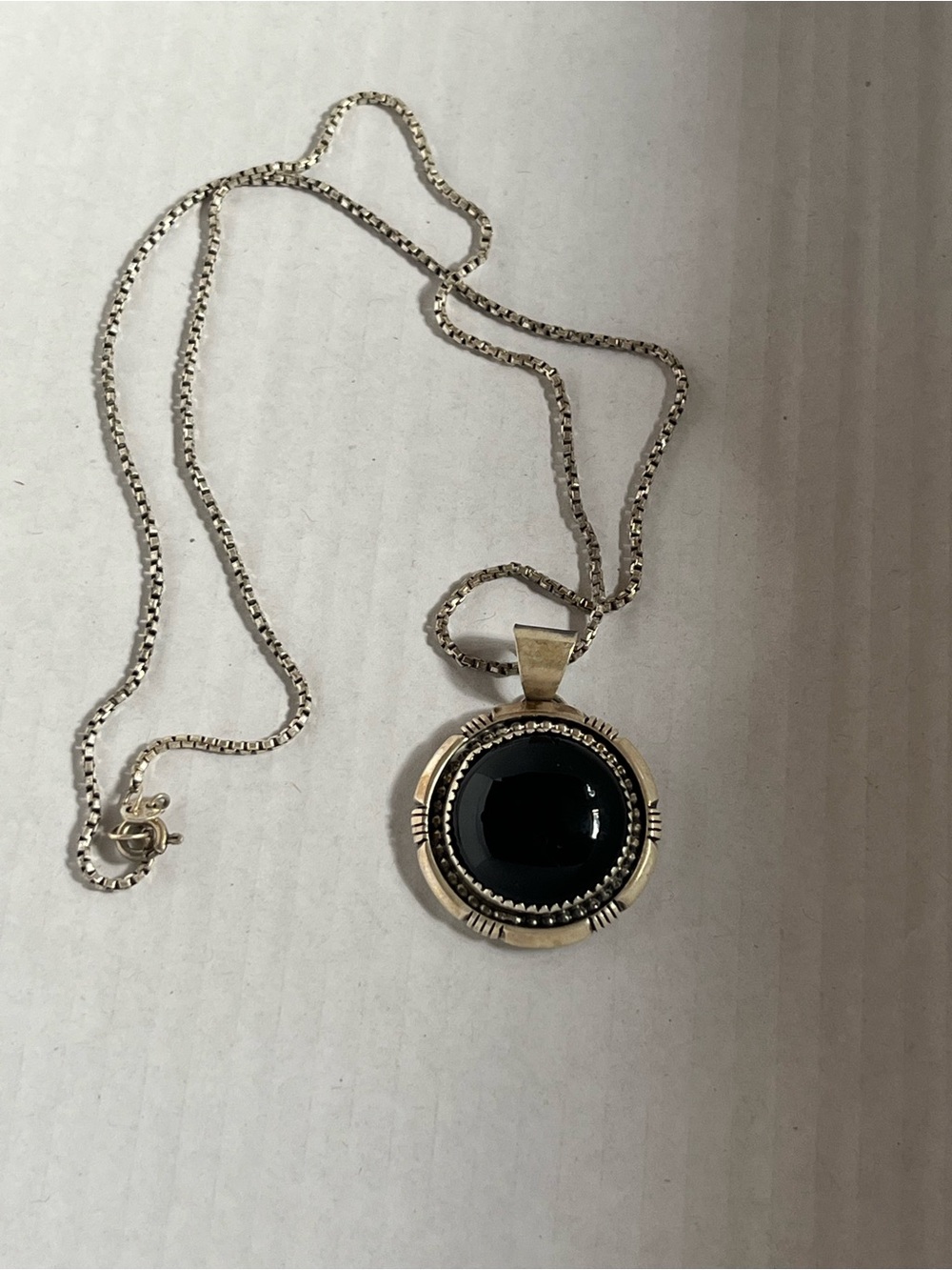 Sterling Silver Black Onyx Southwestern pendant. Signed. 18” chain. Heavy. 16gr
